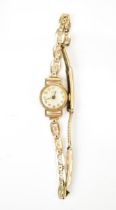 A Tudor, manual wind, ladies, 9ct gold wristwatch, having a silvered dial with Arabic numerals and