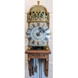 An 18th century and later lantern clock, the four post case with 6" dial applied with Roman numerals