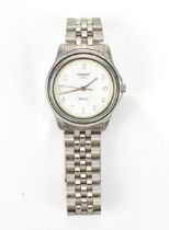 A Tissot PR 50 quartz, gents, stainless steel wristwatch, having a white dial, centre seconds,