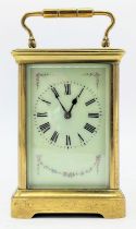 An early 20th century French brass carriage clock, the dial painted with floral swags and having