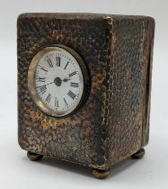 An Edwardian Asprey silver dressing table clock, the case having hammered decoration, initialled '
