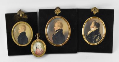 A collection of three early 19th century portrait miniatures on card, depicting a boy, a young