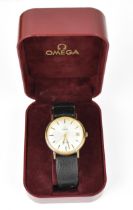 An Omega, manual wind, gents, gold plated wristwatch, having a silvered dial, centre seconds, date