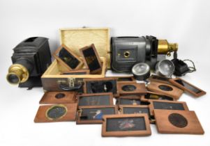 A collection of mechanical and sliding magic lantern slides, of various subjects such as jester