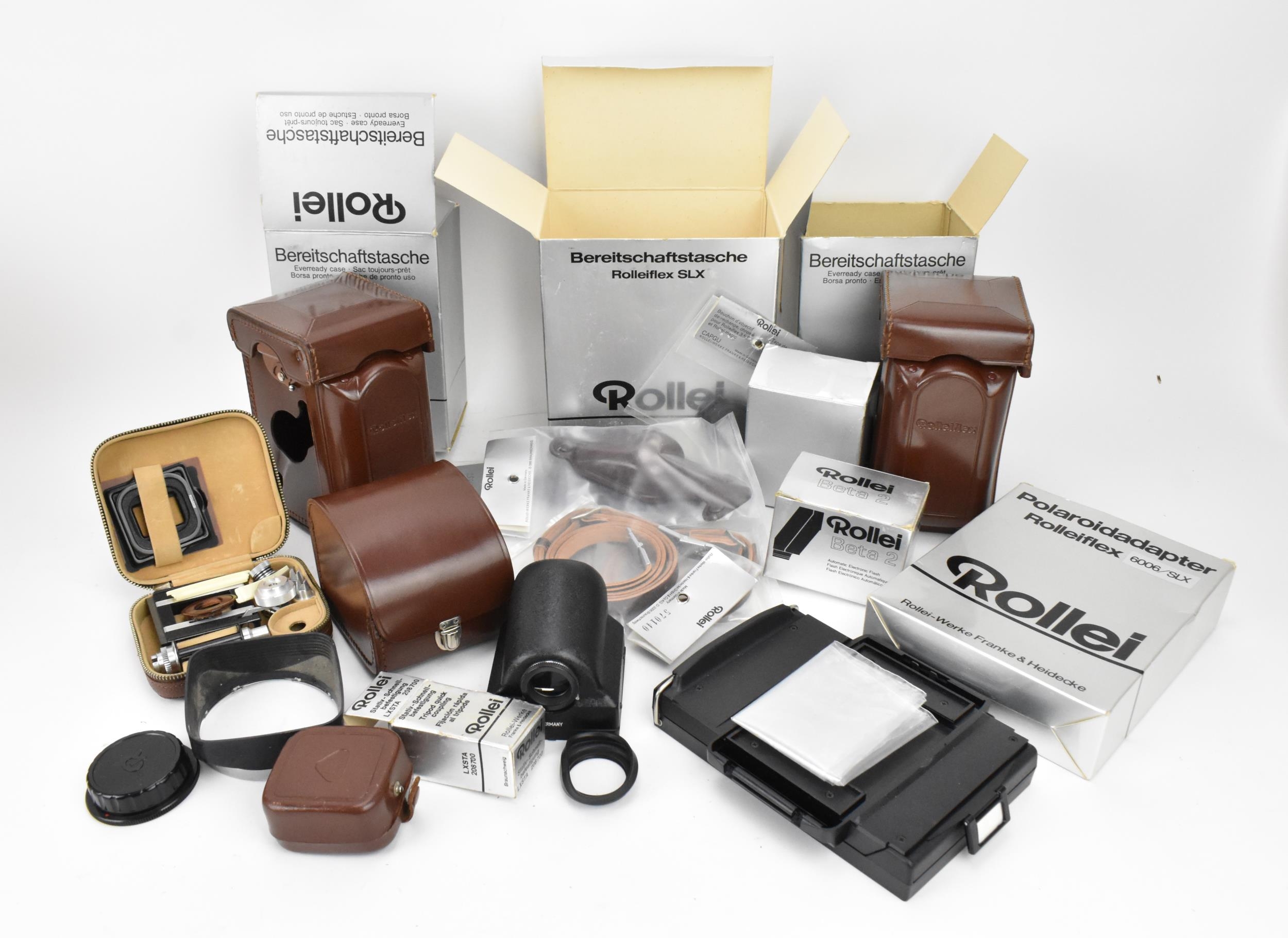 A collection of Rollei photography equipment, to include a prism finder for TLR camera in leather