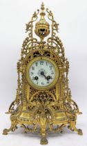 A late 19th century French gilt metal mantle clock, the case having pierced scroll design with