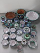A collection of Cornish Tintagel pottery to include bowls, lidded pots, vases, jugs and others