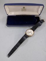 A Garrard 9ct gold automatic gents wristwatch together with Garrard box Location: