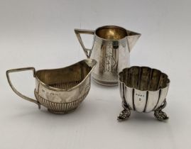 Mixed silver to include a three footed salt hallmarked London 1873 together with two silver cream