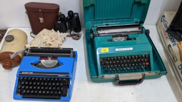 Vintage collectables to include two typewriters, binoculars, a stone hot water bottle and a shell