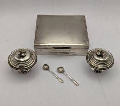 White metal to include an engine turned design lidded box, together with a pair of white metal