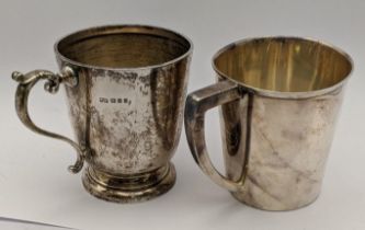 A silver cup hallmarked London 1922, 144.2g, together with a white metal cup, 98.3g Location: