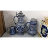 Three German salt glazed tankards to include one having a peter lid Location: