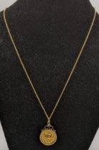 A half sovereign and frame, and a 9ct gold necklace Location: