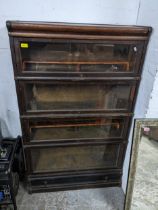 An early 20th century oak Globe Wernicke bookcase with four glass doors and a drawer 142cm x 86cm