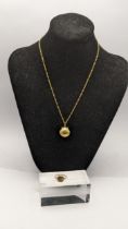 a 18ct gold pendant fashioned as a sea shell 1.2g on a 9ct gold necklace, along with a ladies 9ct