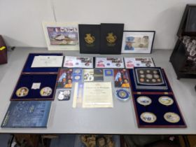 A quantity of commemorative coins and coin sets to include 2000 UK Brilliant uncirculated proof set,