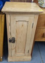 A 19th century and later pine single door pot cupboard on a plinth base 80cm h x 39cm w Location: