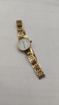 A 9ct gold ladies manual wind wristwatch and a 9ct gold bracelet, total weight 13.1g Location: