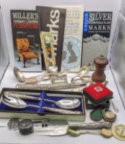 A mixed lot to include a silver embossed parasol handle, silver handled flatware, silver plated