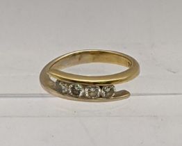 An 18ct gold ring inset with four diamonds, total weight 4.1g Location: