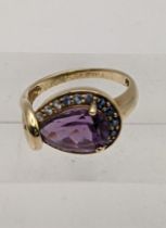 A 9ct gold pear cut amethyst and sapphire ring, total weight 3.8g Location:
