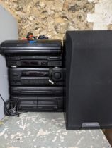 A Kenwood stereo stacking system with speakers to include a P-28 turntable, a DP-28 CD player and