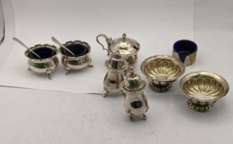 Mixed silver condiment to include a pair of pepper pots, one A/F, silver salts, a mustard pot and