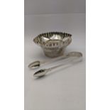A late 19th/early 20th century silver sugar bowl having crimped shaped edges, together with a pair