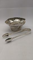 A late 19th/early 20th century silver sugar bowl having crimped shaped edges, together with a pair