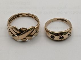 Two 9ct gold rings, one puzzle ring and a gypsy ring set with three non precious stones 7.7g