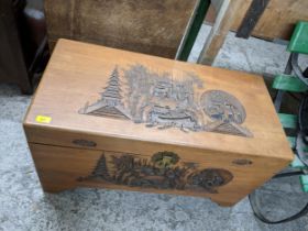 An Oriental carved wooden camphor chest with brass catch and lock 51cm x 90.5cm x 44cm Location: