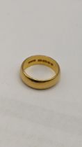 A 22ct gold wedding band, size O, 7.9g Location: