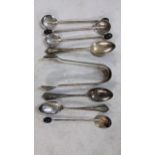 Mixed silver to include sugar tongs, coffee bean spoons, and teaspoons, 86.6g Location: