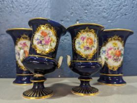 A pair of Meissen porcelain blue vases A/F having painted gilt and floral decoration, along with a