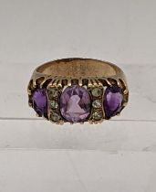 A 9ct gold ring set with amethyst and sapphires total weight 5.1g Location: