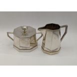 A white metal cream jug stamped 800 along with a matching lidded sugar pot, total weight 313.7g