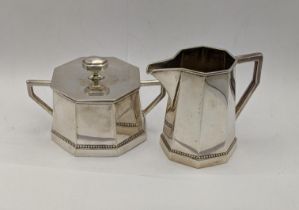 A white metal cream jug stamped 800 along with a matching lidded sugar pot, total weight 313.7g