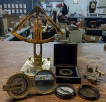 Scientific instruments to include a compass, a miniature sextant, and an astronomical quadrant and