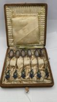 Six Continental coffee and enamel spoons in case, total weight 46.5g Location: