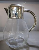A large silver plated and glass water/lemonade jug Location:
