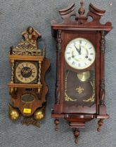 A reproduction of a Dutch Stohl wall hanging clock having pierced gilt metal spandrels and in an oak