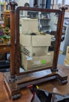 A Victorian mahogany dressing table mirror having turned columns and four scrolled feet 76.5cm x