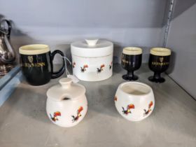 Carlton ware Guinness advertising ceramics comprising two eggcups, condiments, a mug and a lidded