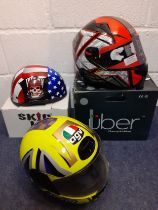 Three decorative helmets to include Skid Lid and Uber for decoration only, all with original boxes