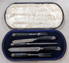 A late Victorian Joseph Rodgers & Sons horn handled carving set in a fitted case Location: