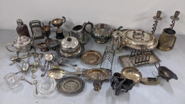 A mixed lot of mainly silver plate to include a toast rack, candlesticks, teapot and other mixed