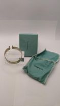 A Tiffany & Co sterling silver bracelet fashioned as a bicycle trouser clip, boxed Location: