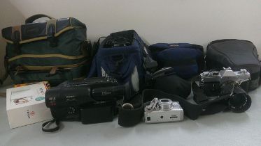 A selection of cameras and accessories together with a Cannon UC8 video camera Location: