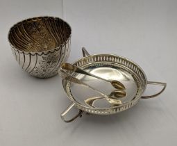 A three handle sugar dish having a pierced edge, hallmarked Chester 1913, together with a pair of